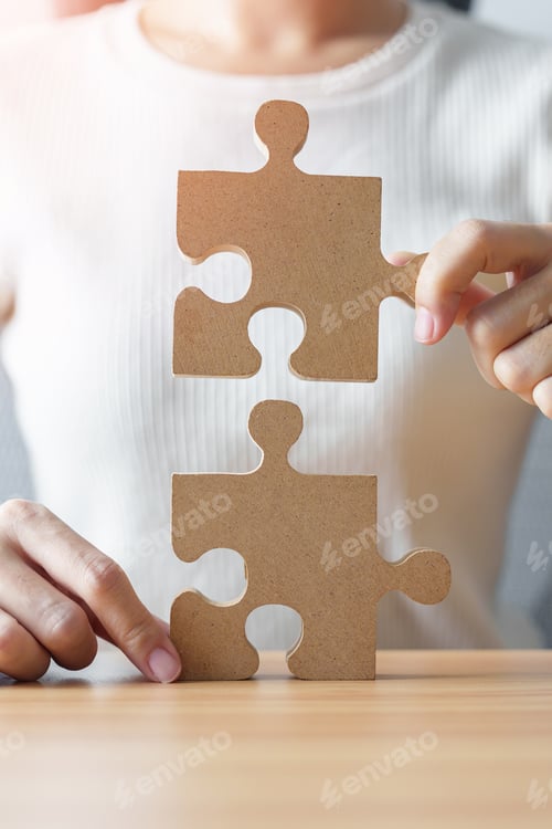 Preview: Hand connecting couple puzzle piece. Business Solving
