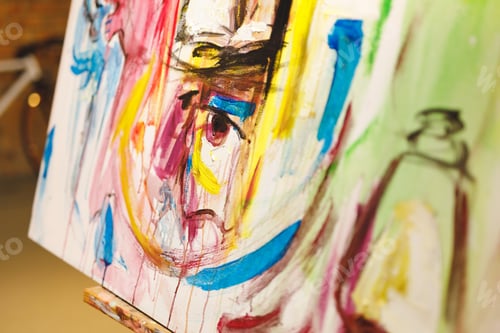 Preview: Close up of modern abstract oil painting on canvas sitting on easel in artists studio