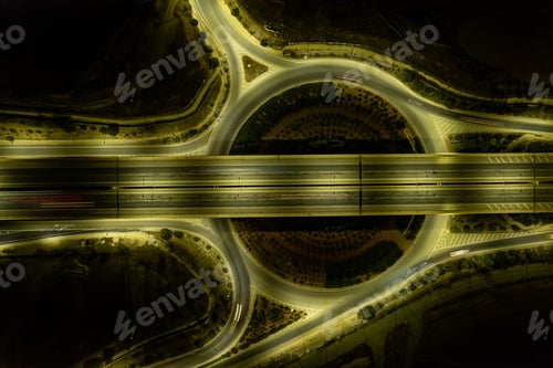 Preview: Aerial drone top view of motorway junction. Roundabout cars moving. Transportation infrastructure