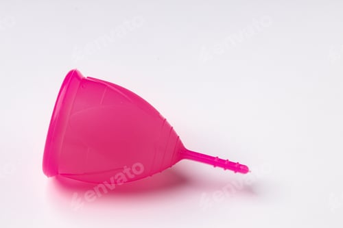 Preview: Pink silicone menstrual cup on white background