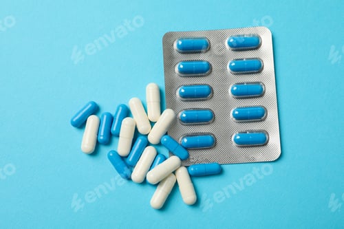 Preview: Blister pack and pills on blue background