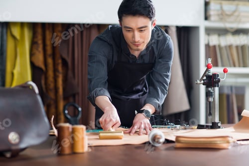 Preview: Craftsman working in his studio