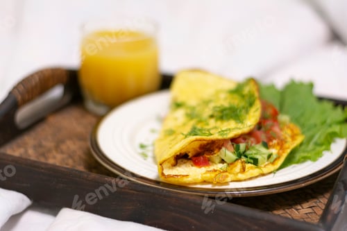 Preview: Tray of romantic healthy breakfast food on bed n a hotel room service close up