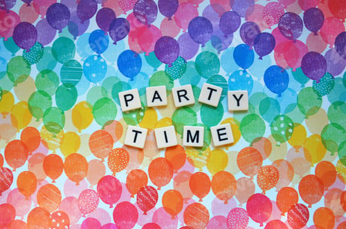 Preview: Party Time spelled out in letter tiles on colourful balloon themed background