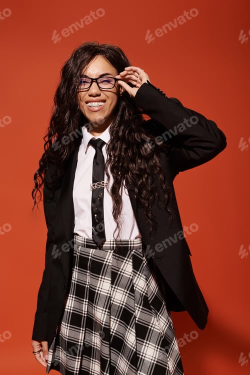 Preview: Young woman embodies student aesthetics with stylish outfit against vivid background