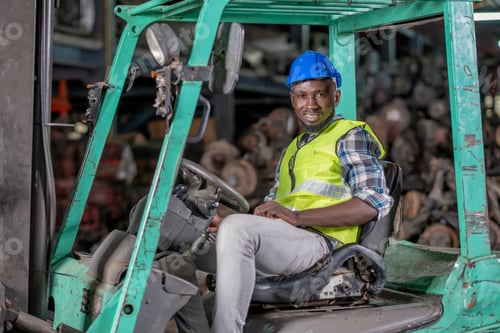 Preview: Portrait of African American factory man with smiling sit on forklift during work