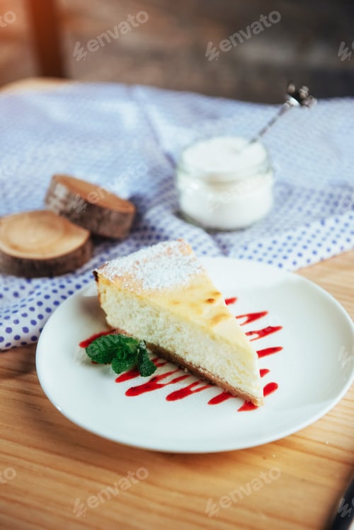 Preview: triangle cheese cakes in cafe. On a wooden table