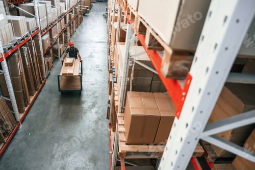 Preview: going with boxes, distant view. Foreman is in the storehouse, shipping distribution business