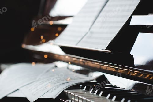 Preview: Piano keys with notes in dark close up