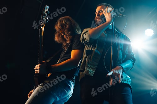 Preview: Rock band performing live on stage with passion and energy