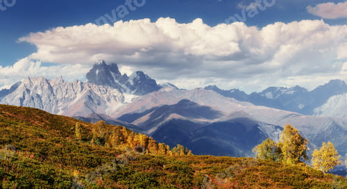 Preview: Magic autumn landscape and snow-capped mountain peaks. View of t