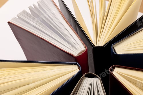 Preview: Image of central composition with books standing on white surface
