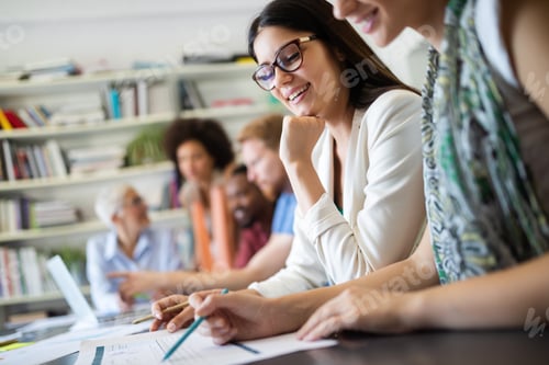 Preview: Cheerful coworkers in office during company meeting