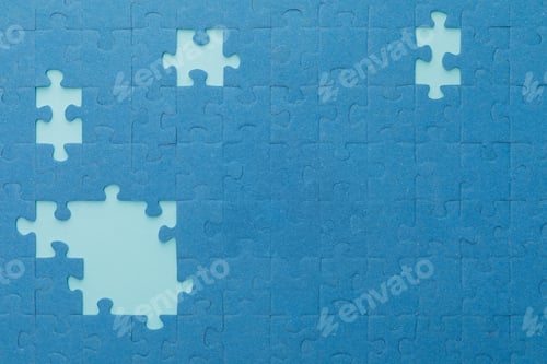 Preview: top view of unfinished blue jigsaw puzzle on lighter background