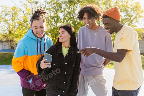 Preview: Multiracial group of young friends bonding outdoors