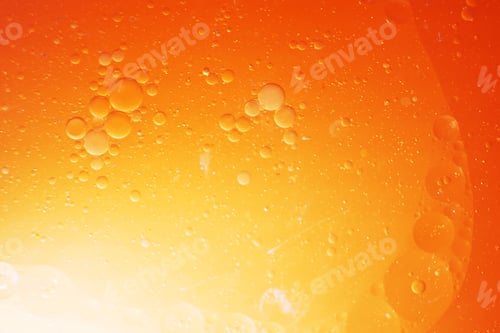Preview: Gold Oil bubbles close up. circles of orange water macro. abstract shiny yellow background