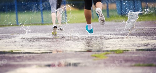 Preview: Couple running in rainy weather