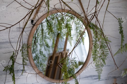 Preview: Fresh eucalyptus branches and bathroom items on countertop