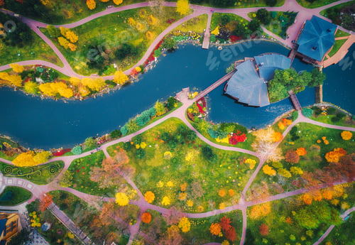 Preview: Aerial view of amazing autumn park with pond in europe