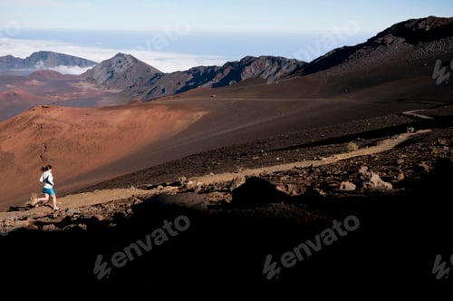 Preview: Woman running on dirt road