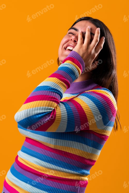 Preview: Young woman laughing with vibrant fashion style