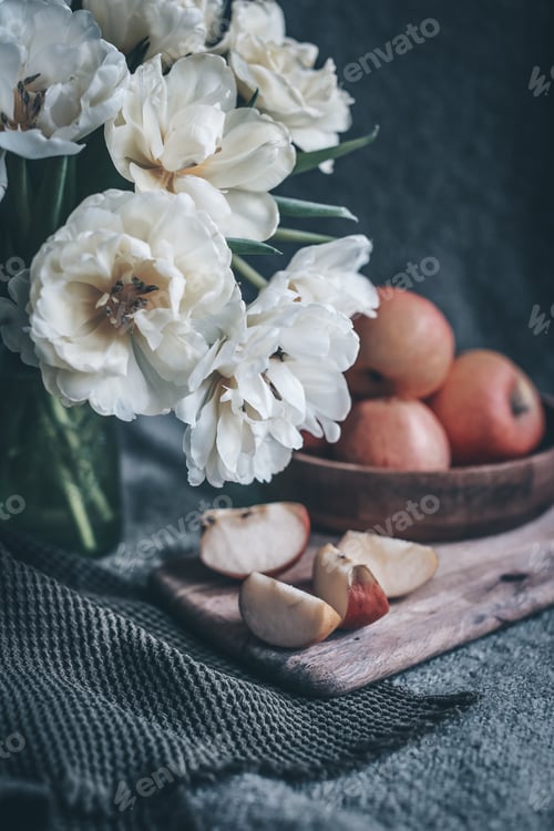 Preview: still life flowers in a vase tulips and red apples on a plate