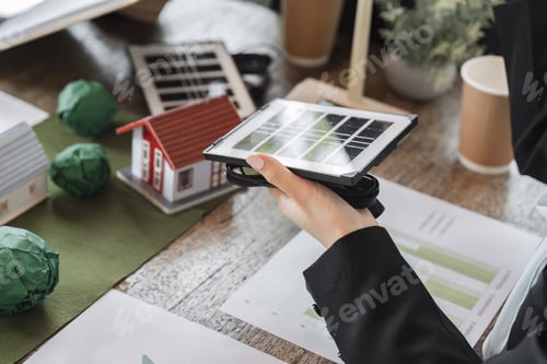 Preview: A team reviewing solar technology for improving energy efficiency in homes.