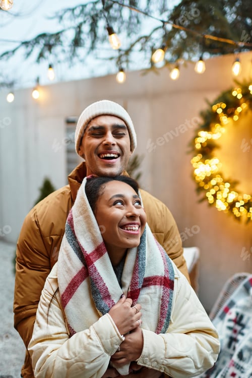 Preview: Cozy winter love captured under festive lights and decorations