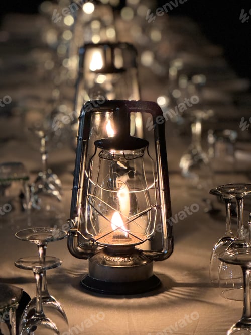 Preview: Rustic oil lamp centerpiece with warm candlelight