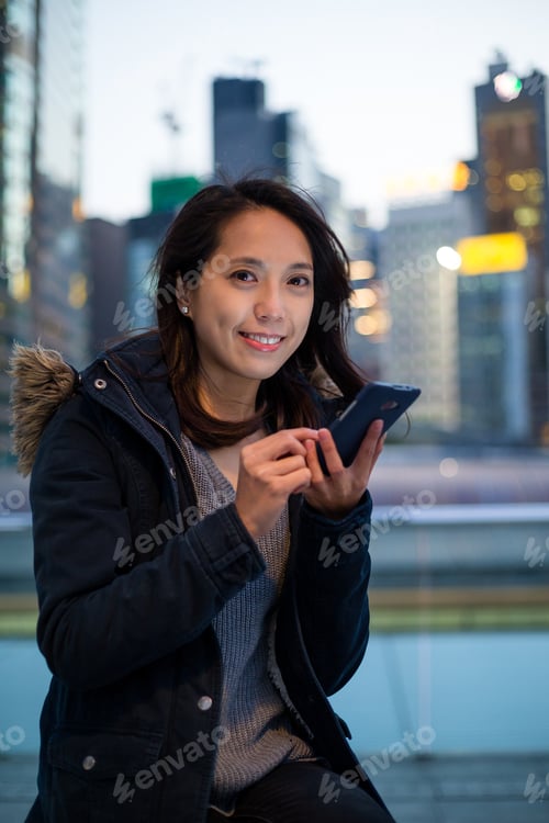 Preview: Woman use phone at night