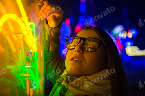 Preview: Stylish young woman near illuminated board