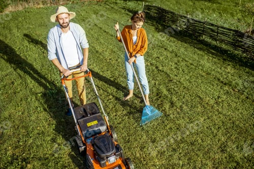 Preview: Man and woman cleaning green lawn