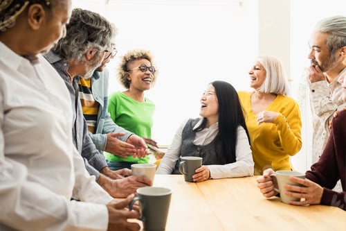 Preview: Happy multiracial people with different ages and ethnicities having fun drinking a cup of coffee