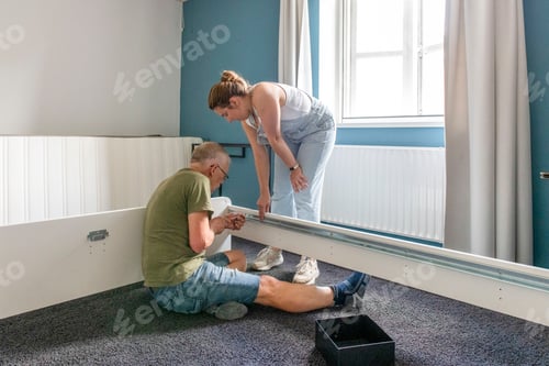 Preview: Two people working together on a home improvement project.