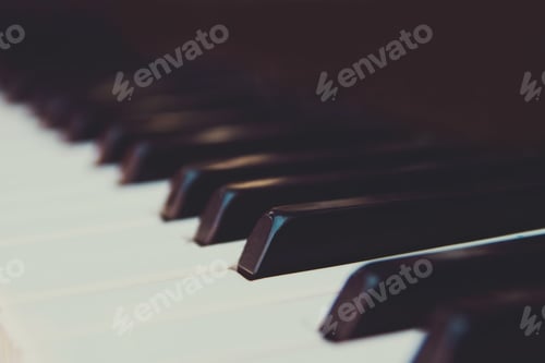 Preview: Black and white piano keys closeup.