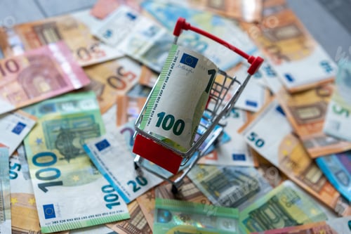 Preview: Closeup shot of a 100 Euro banknote in a small cart