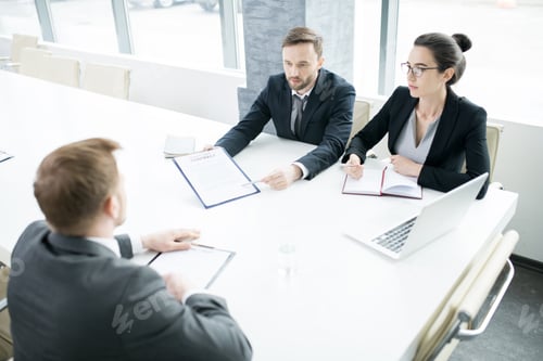 Preview: Business People at Meeting Table