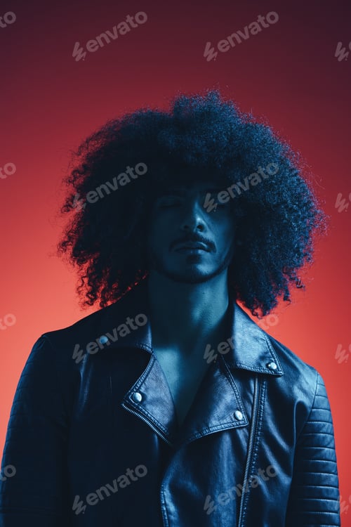 Preview: Portrait of fashion man with curly hair on red background multinational, colored light, black