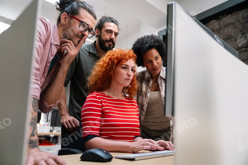Preview: Group of young happy creative team, multicultural coworkers working in office together