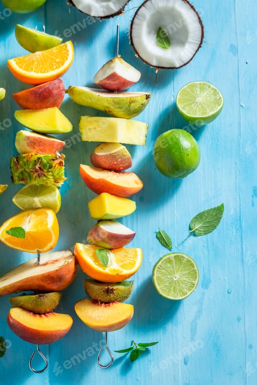 Preview: Top view of homemade skewers with mix of fruits