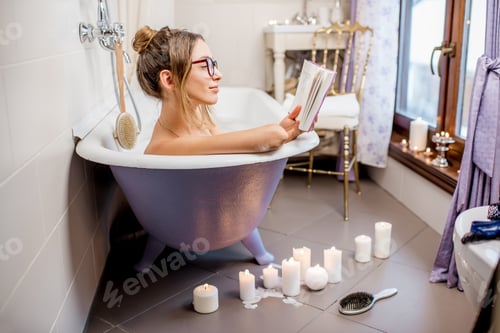 Preview: Woman reading book in the bathroom