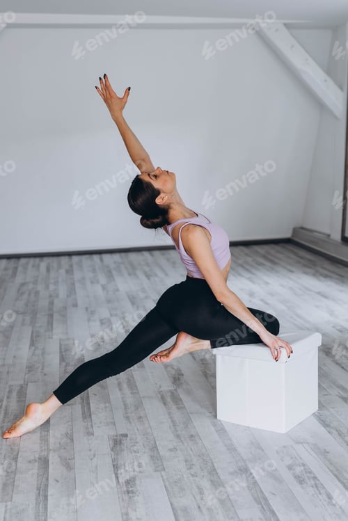 Preview: Sporty flexible girl doing stretching exercise