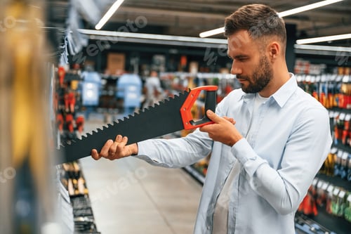 Preview: Searching for the tools. Man is in the hardware shop