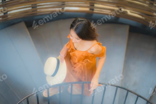 Preview: Portrait beautiful young asian woman walk on circle stair