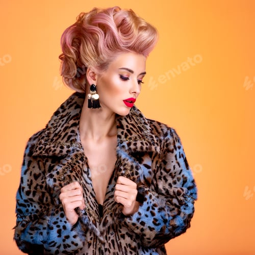 Preview: Beautiful woman with style hairstyle. White woman with bright colored makeup.