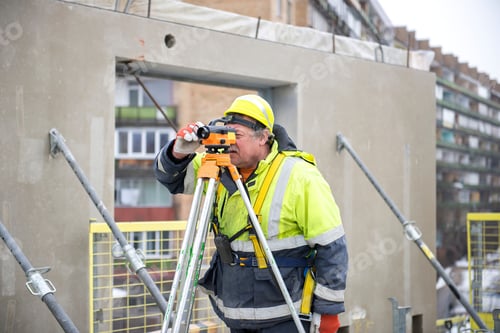 Preview: One real senior surveyor worker working with theodolite or tacheometer transit equipment