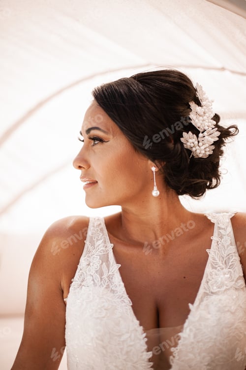 Preview: Elegant Woman in White Dress Looking off Camera