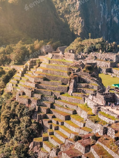 Preview: Aerial view of Machu Picchu's terraced landscape and ancient structures.