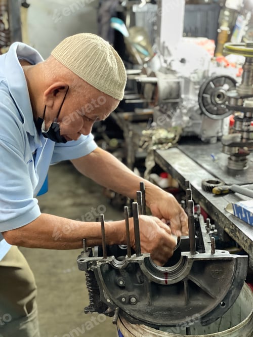 Preview: senior doing repair car engine
