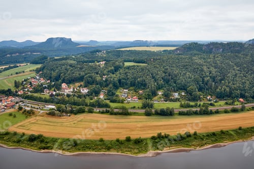 Preview: aerial view of beautiful elbe river, fields and small town in Bad Schandau, Germany